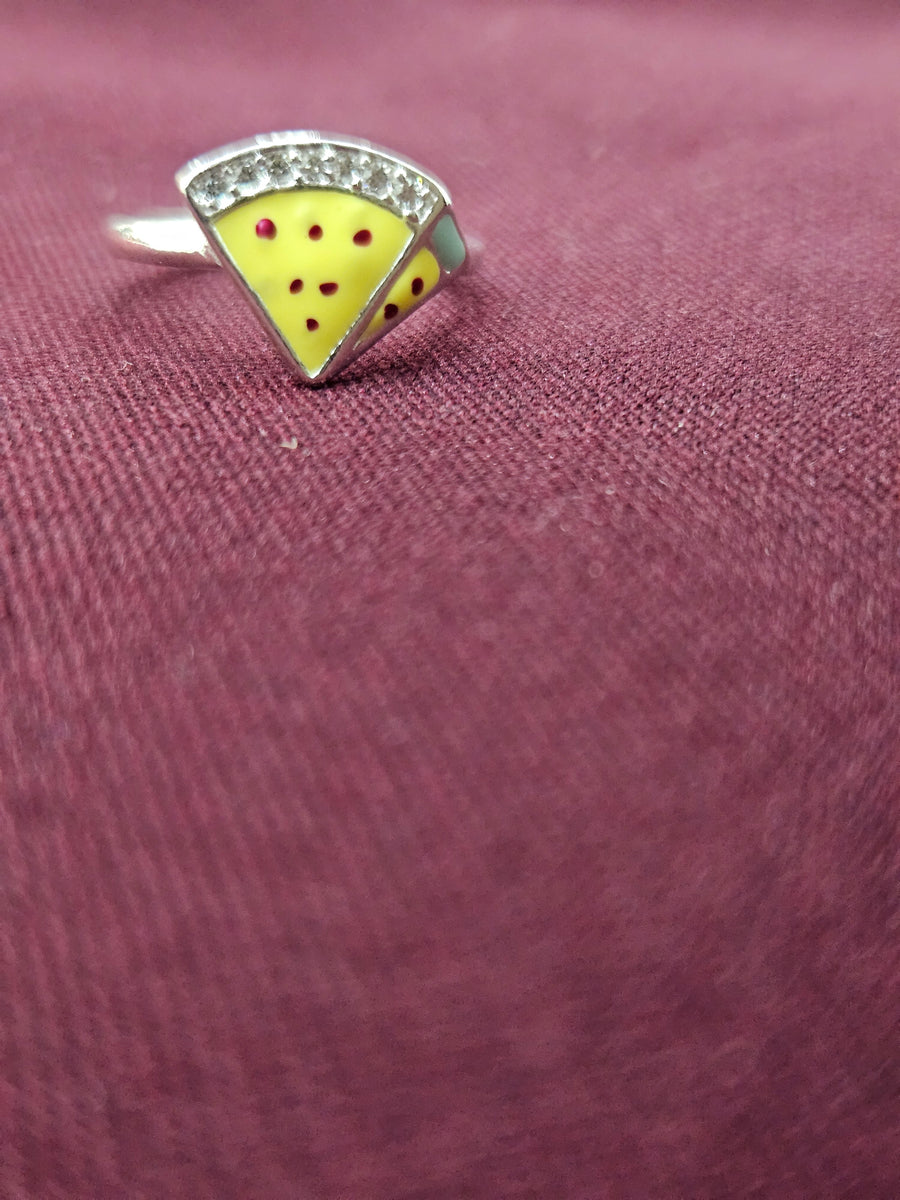 Silver-tone kids ring with yellow triangular face, red dot accents, and clear stones along the top