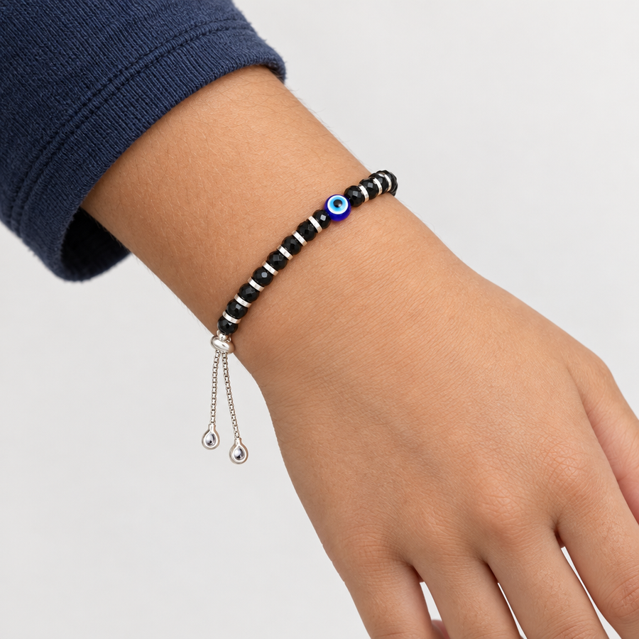 Single Evil Eye Black Bead Kadli worn on a child aged 7 to 9 years