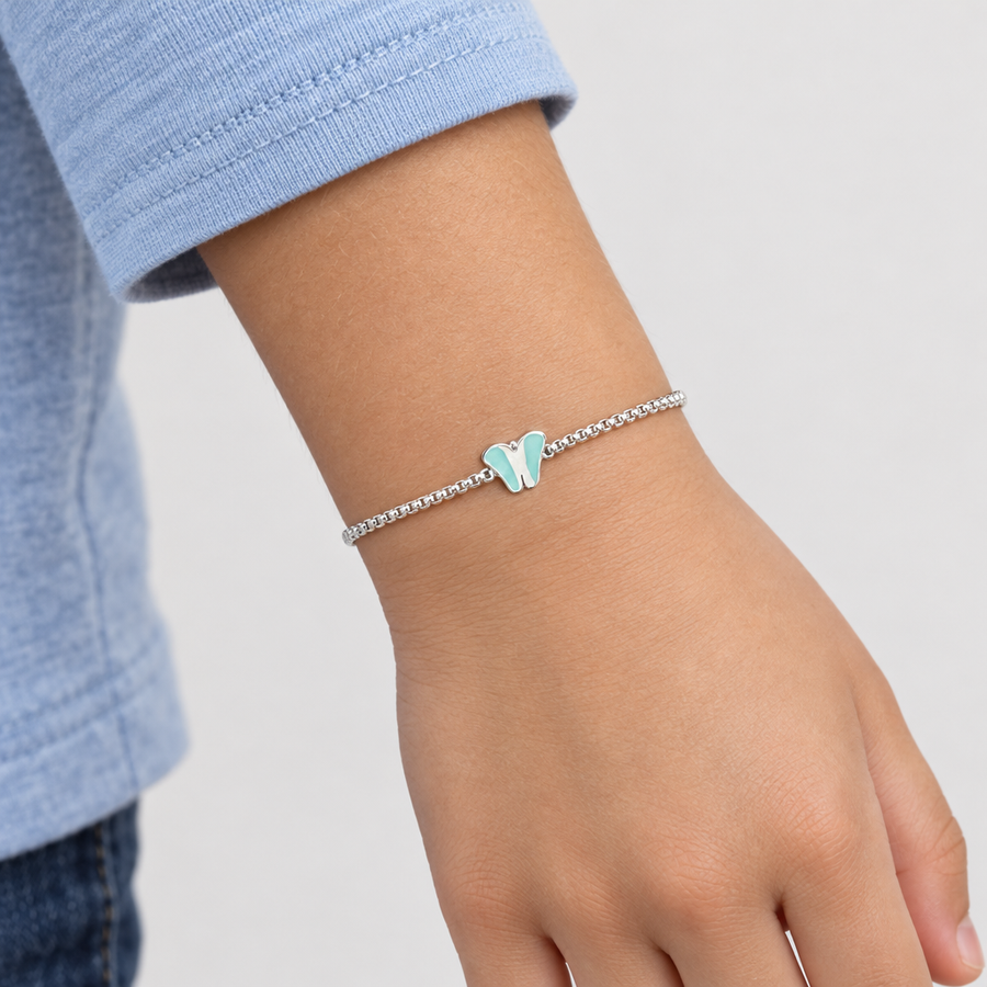 Blue Butterfly Kids Bracelet worn on a child aged 7 to 9 years