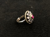 Round Ruby Halo Silver Ring, angled view