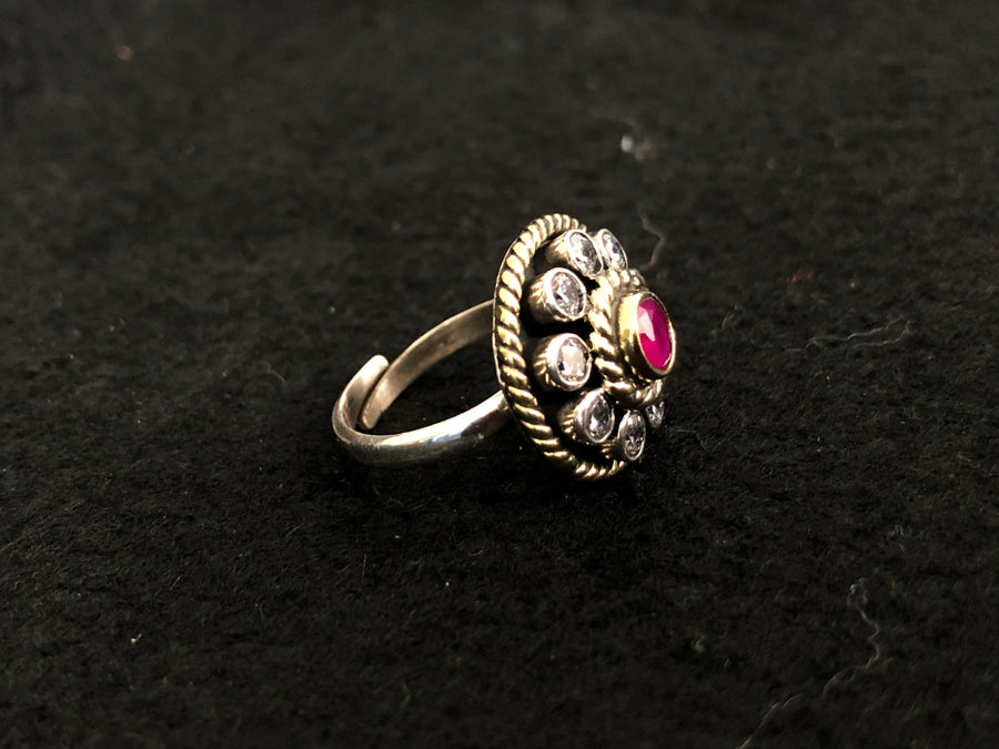 Round Ruby Halo Silver Ring, angled view