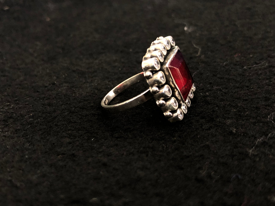 Ruby Halo Silver Ring, angled view
