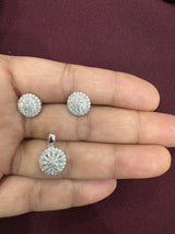 Floral sunburst pendant and matching stud earrings with sparkling clear stones