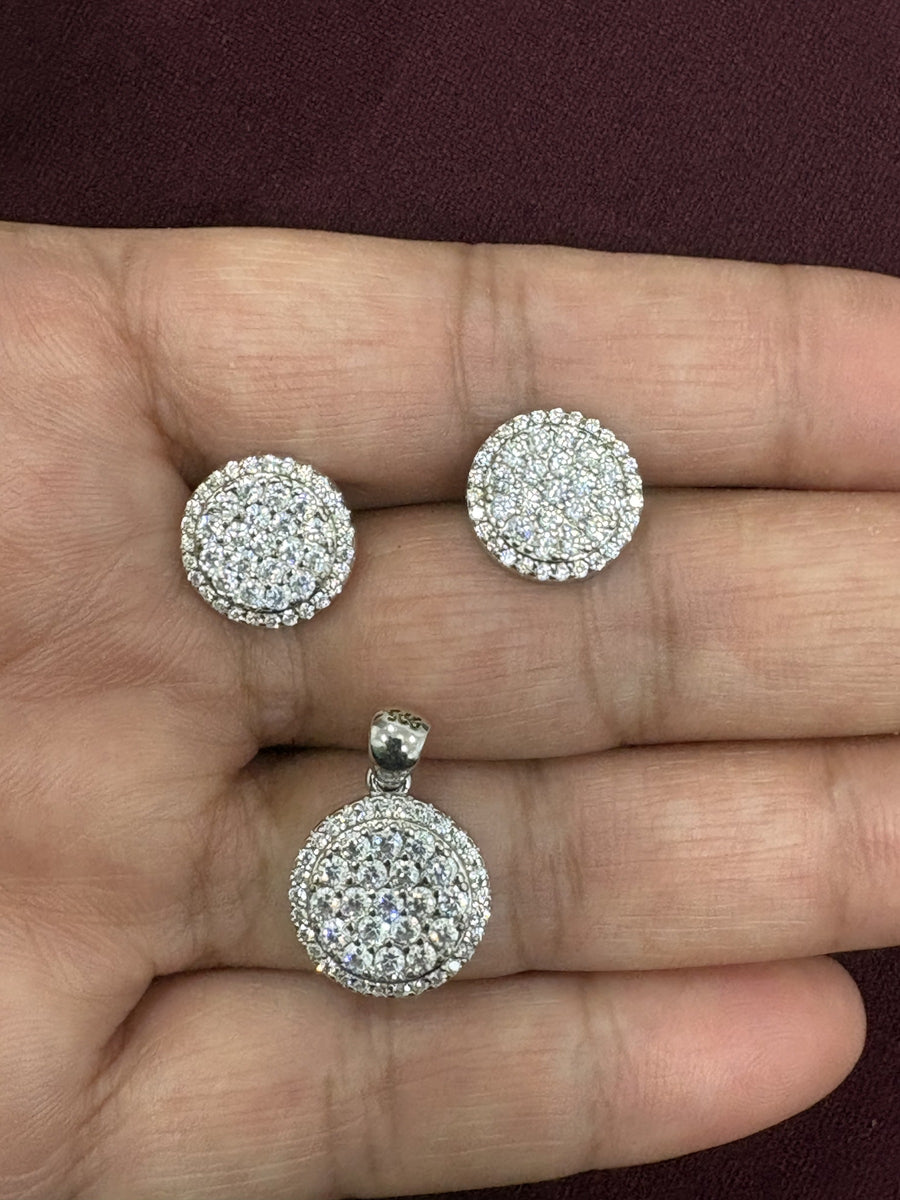 Round pavé disc pendant with matching round earrings in a polished finish