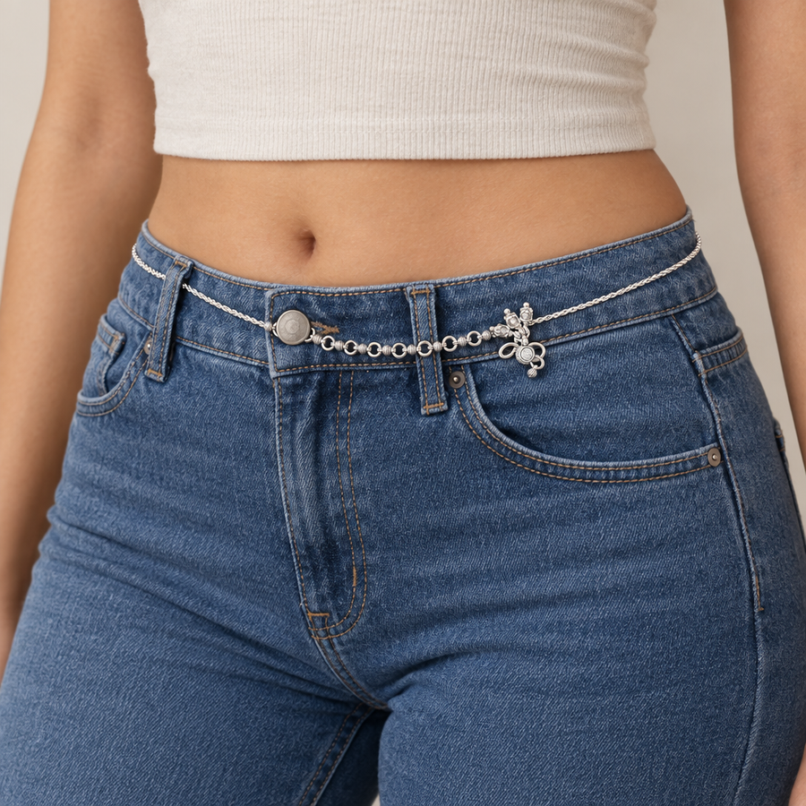 Silver-Tone Figurine-Charm Waist Chain worn over blue jeans
